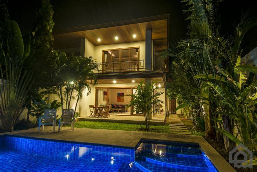 the villa and pool terrace at night