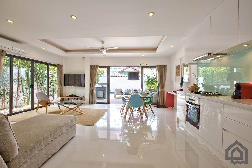 living room and kitchen opening to pool terrace