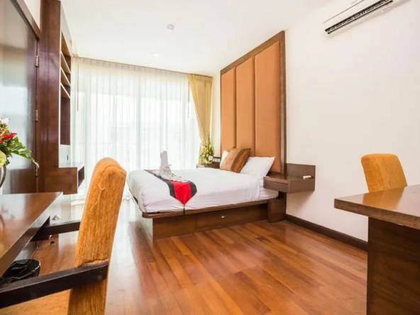 spacious bedroom with dresser