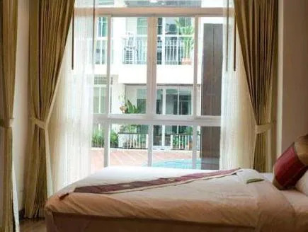 bedroom with pool views