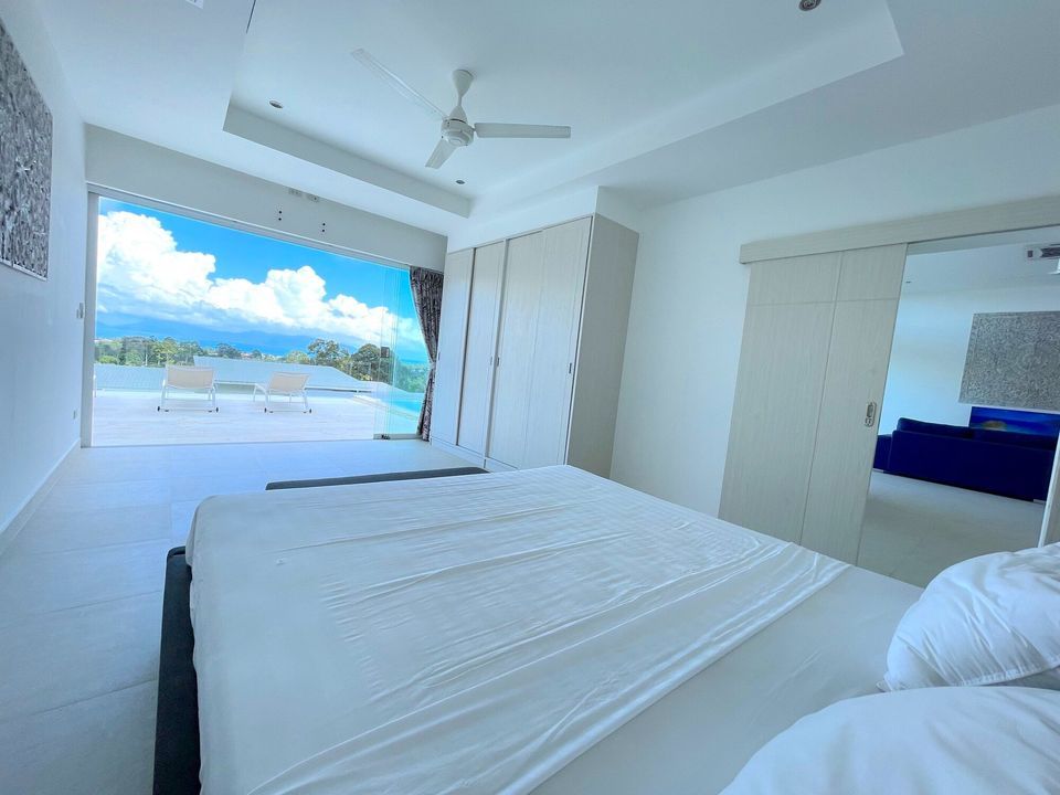 stylish bedroom with sea views