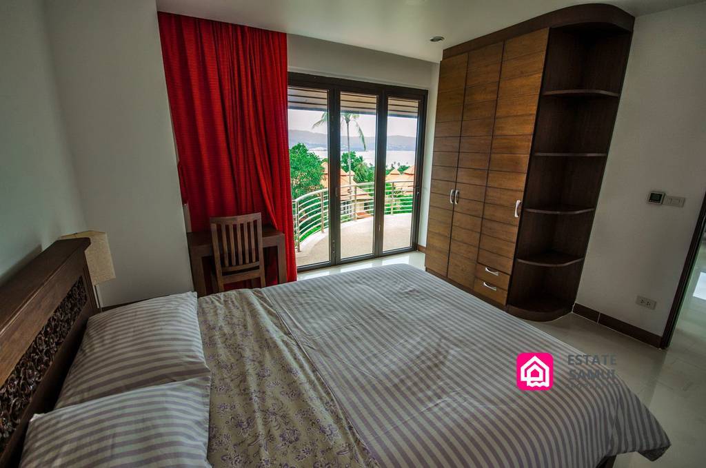 bedroom opening to balcony and sea views