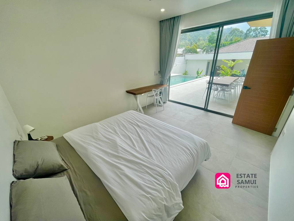 bedroom with pool views