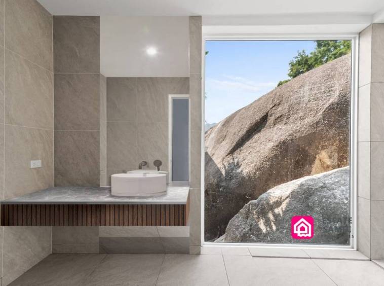 bathroom looking onto granite boulders