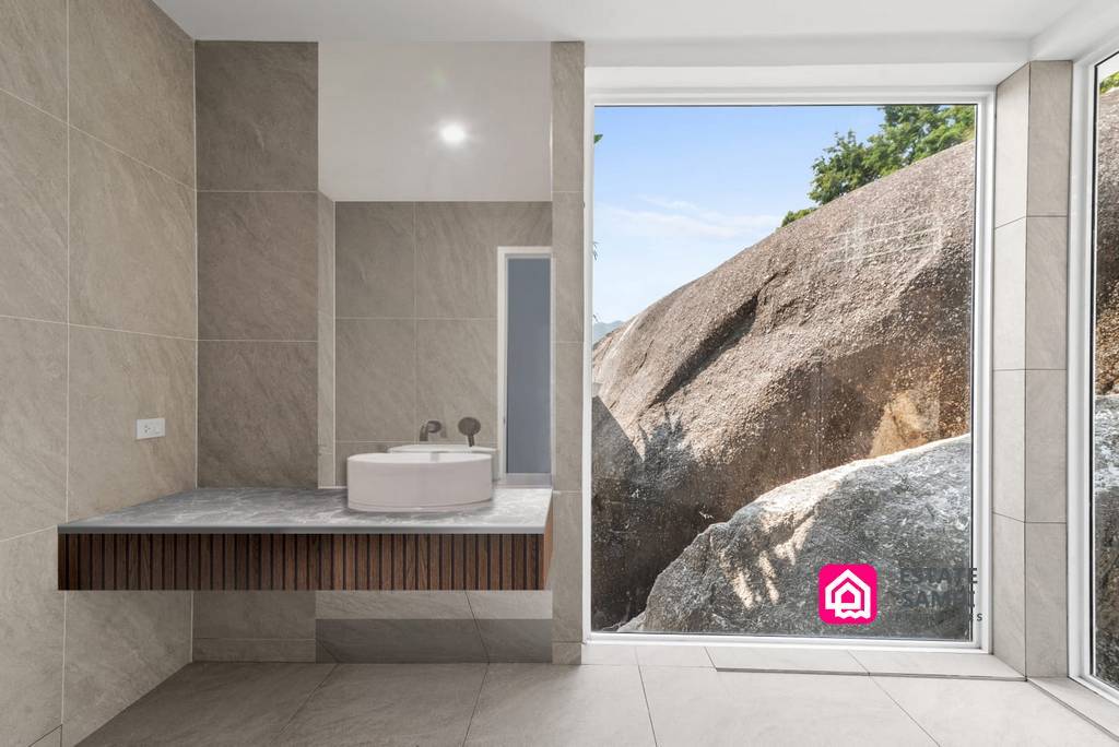 bathroom looking onto granite boulders