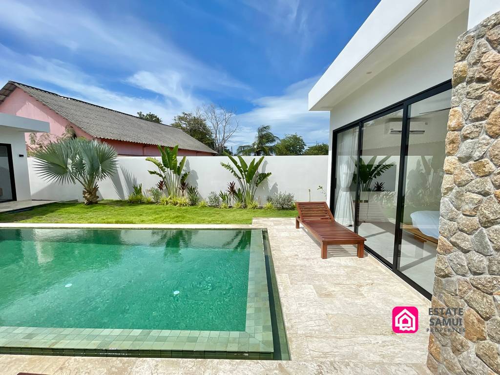 Private swimming pool and lawn at this Bangrak villa