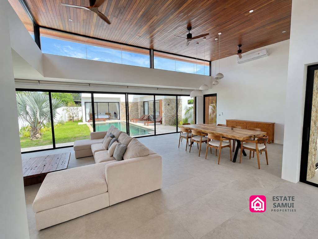 Living area of this Bangrak pool villa opening towards the garden