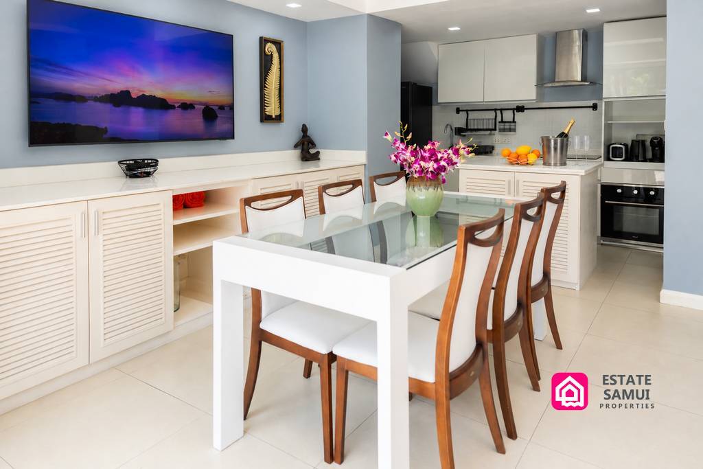 Bright dining area beside modern open-plan kitchen