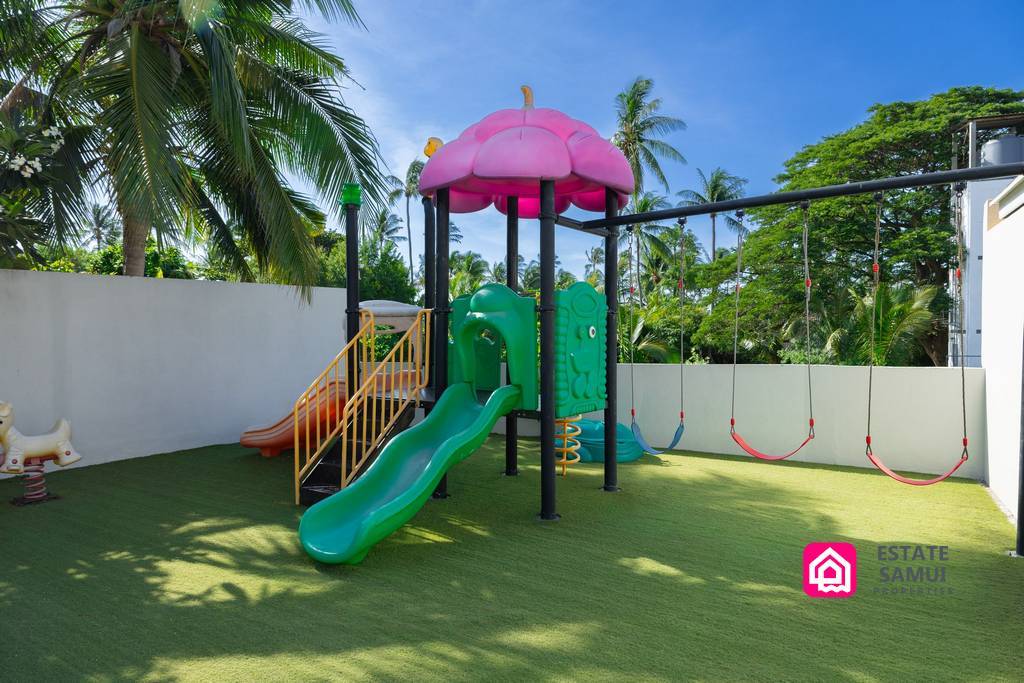 Private children's play area with slides and swings