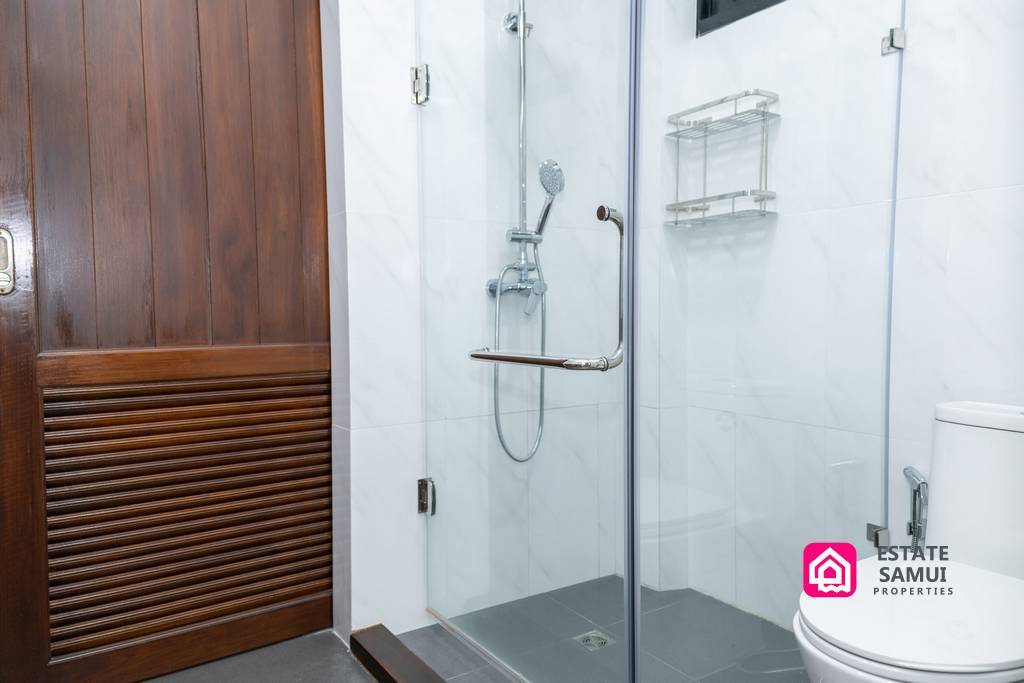Bathroom with glass shower enclosure and modern fixtures