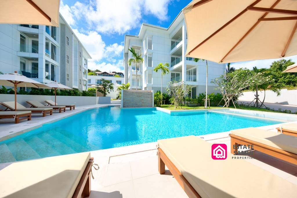 Landscaped communal swimming pool surrounded by modern residences