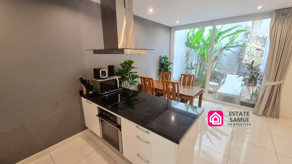 Kitchen and dining space opening onto the private garden