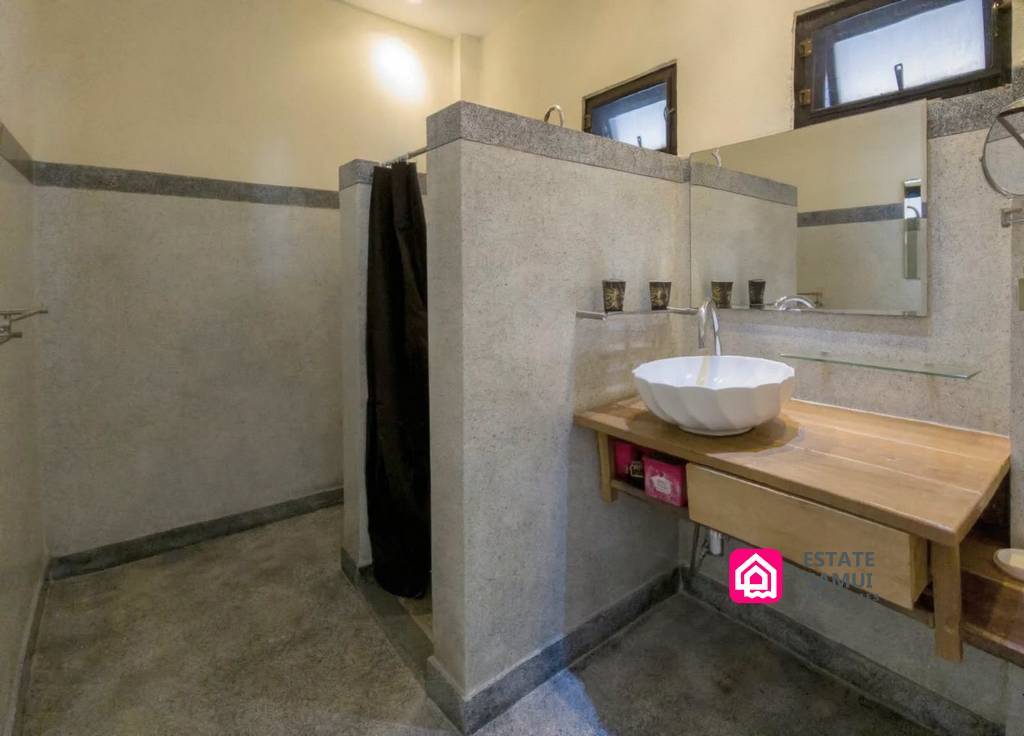 Ensuite bathroom with walk-in shower and wooden vanity