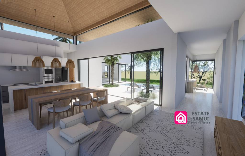 High-ceiling living area with kitchen island and garden-facing glazing