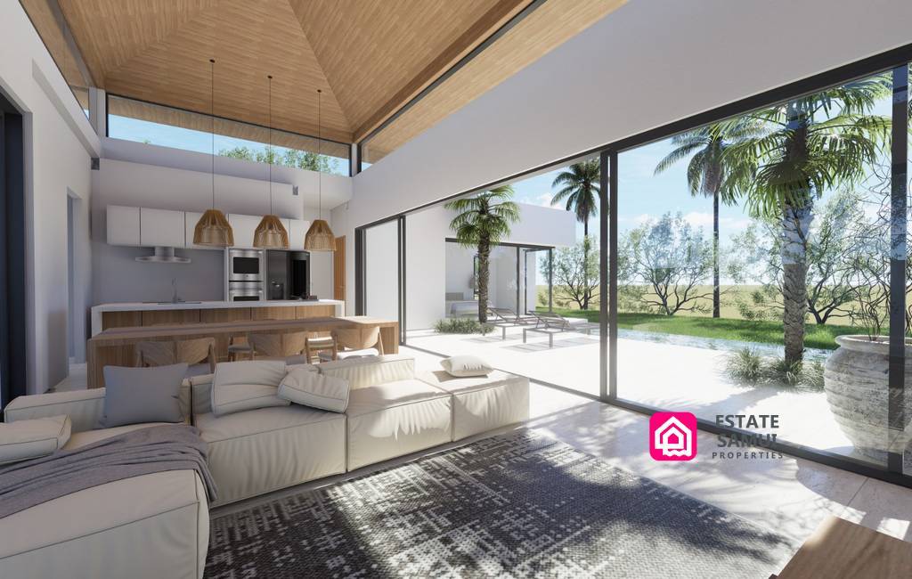 Open-plan Boucami Villas living area overlooking the pool terrace