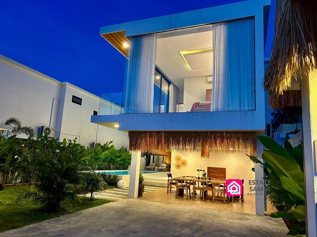 Two-storey villa exterior with covered dining area below