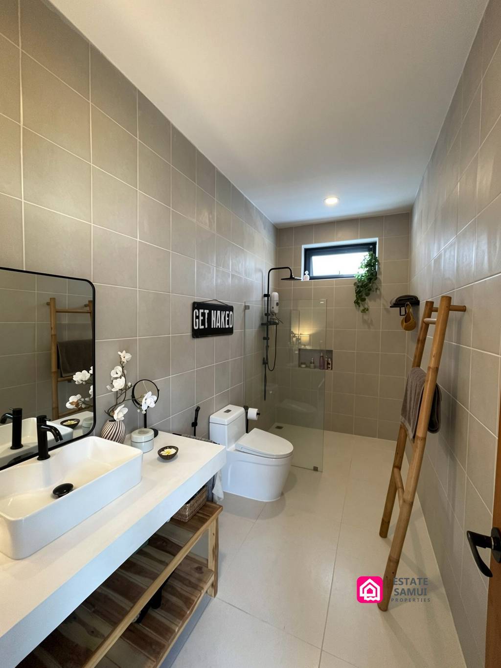 Bathroom with double basin, toilet and walk-in shower