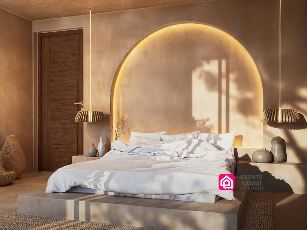 Warm neutral bedroom with illuminated arched headboard and pendant lights