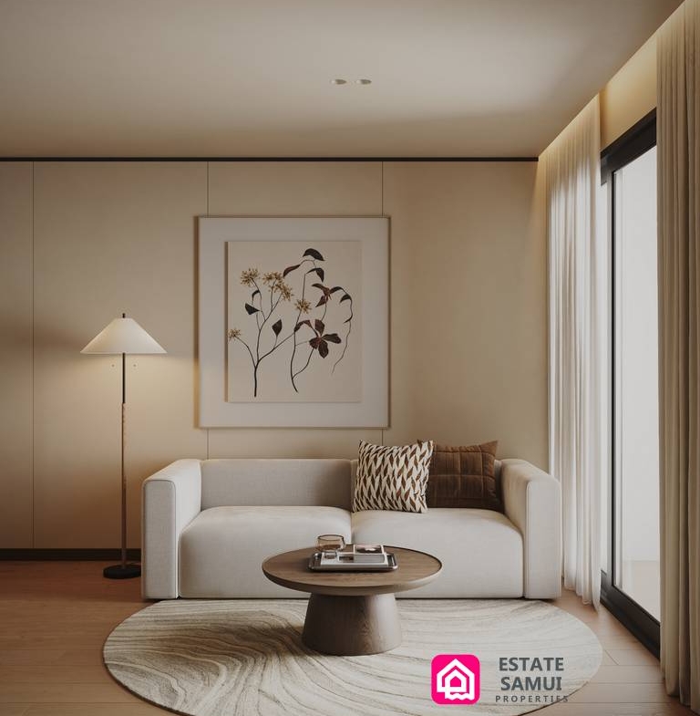 Living area with sofa, round rug and framed artwork