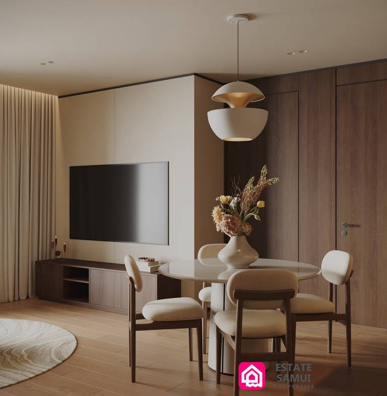 1. Open-plan dining and living area with television and wood cabinetry