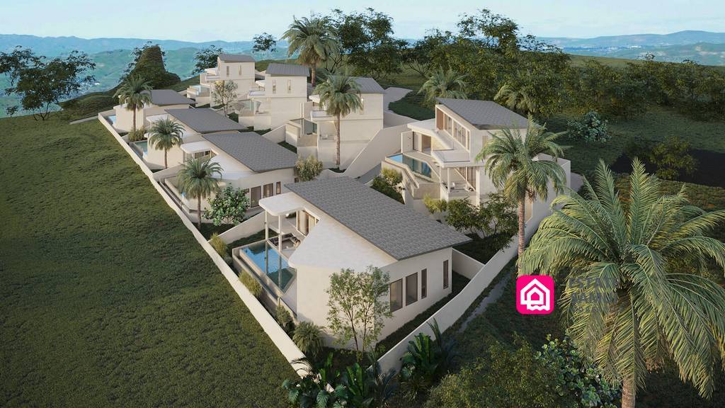Aerial view of modern villas surrounded by lush tropical landscaping