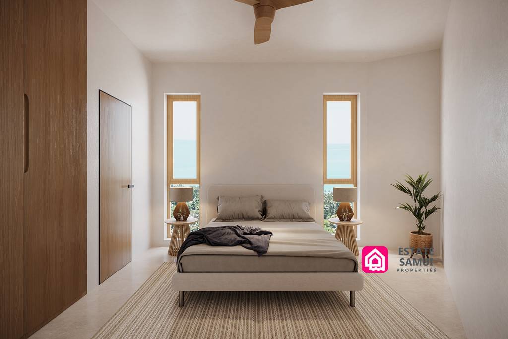 Minimal bedroom with timber finishes and narrow sea-facing windows