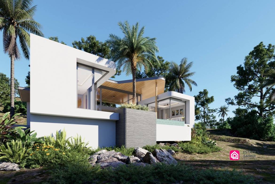 Side exterior of a modern villa with white walls and tropical landscaping.