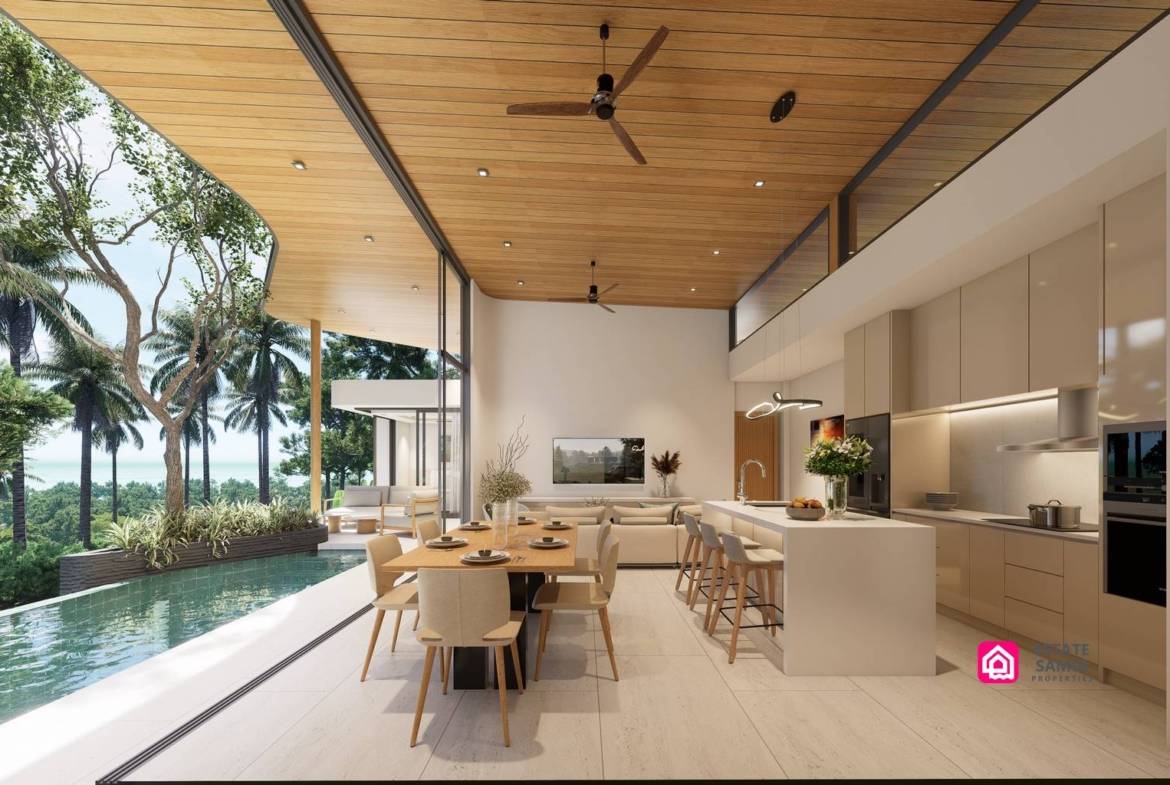 Open kitchen and dining area beside the pool beneath a timber-toned ceiling.