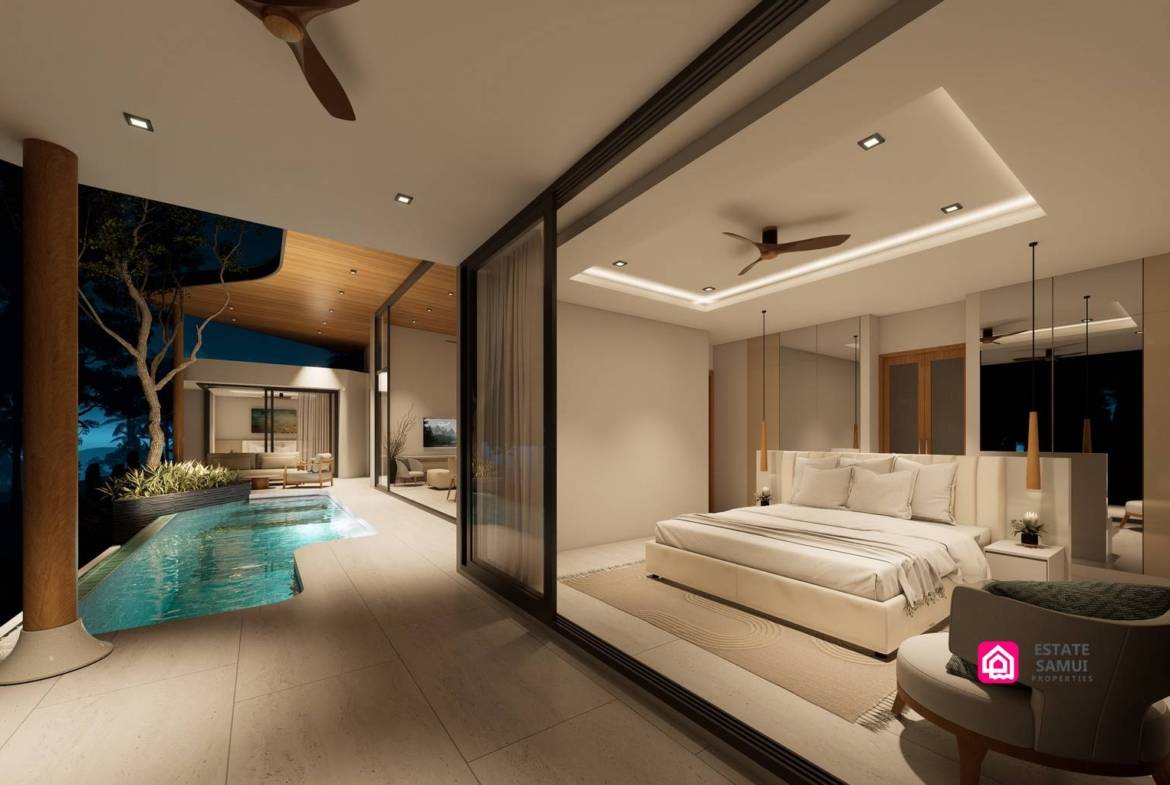 Illuminated bedroom opening onto a covered terrace beside the swimming pool.