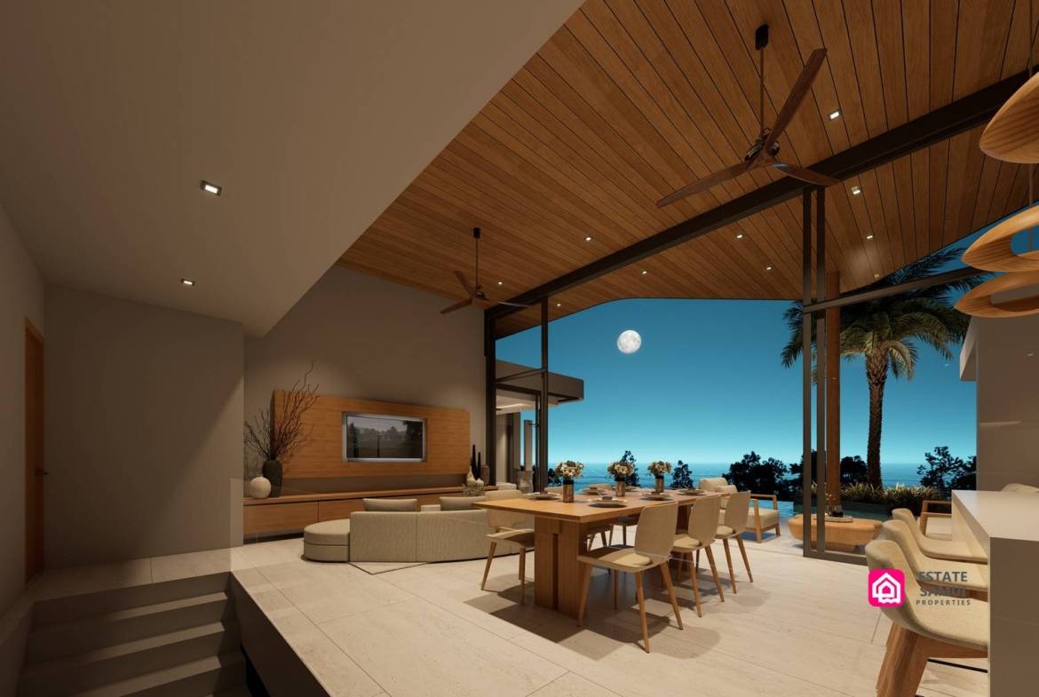 Evening living and dining area opening towards the poolside terrace.
