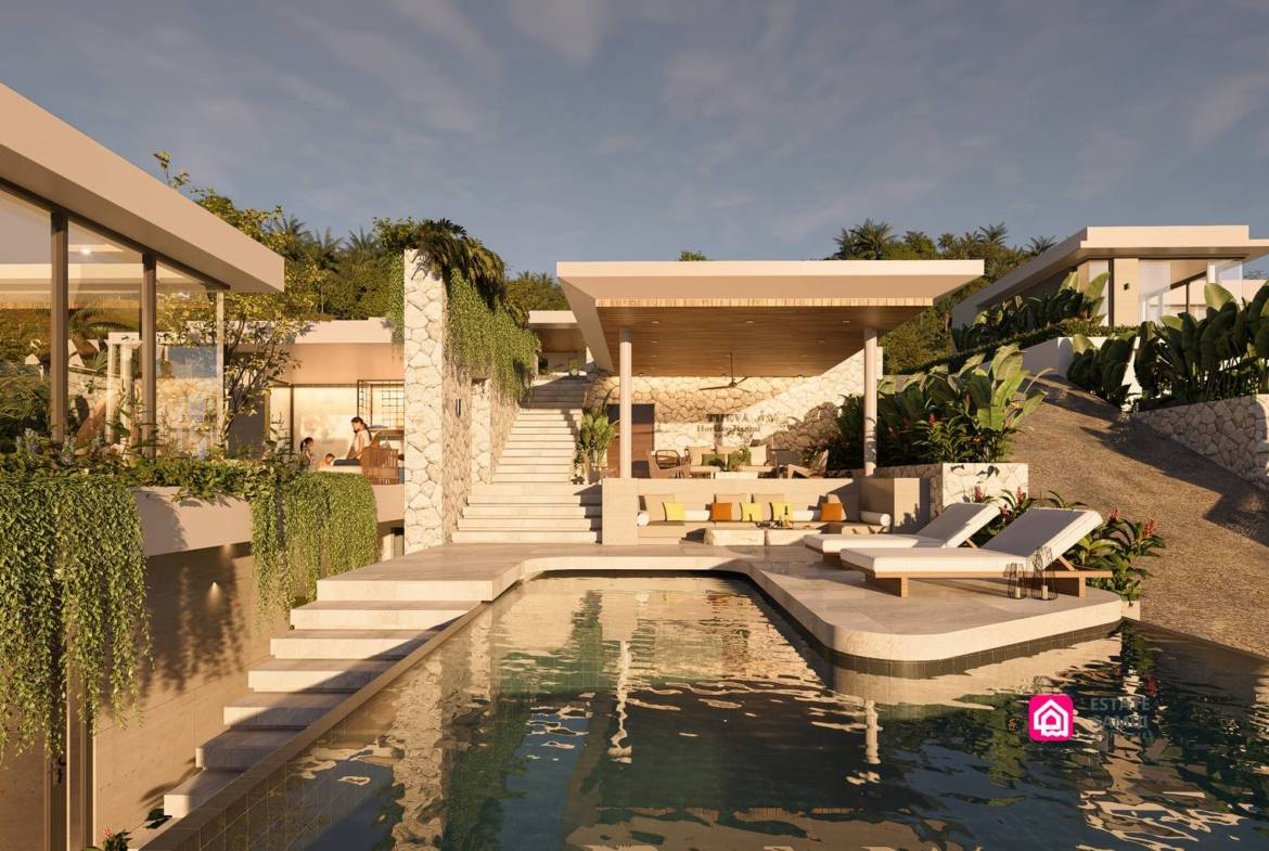 Swimming pool bordered by loungers, stairs and a covered seating area.