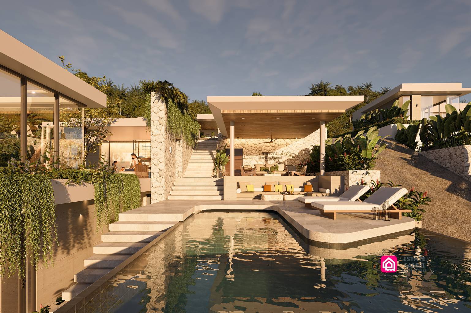 Swimming pool bordered by loungers, stairs and a covered seating area.