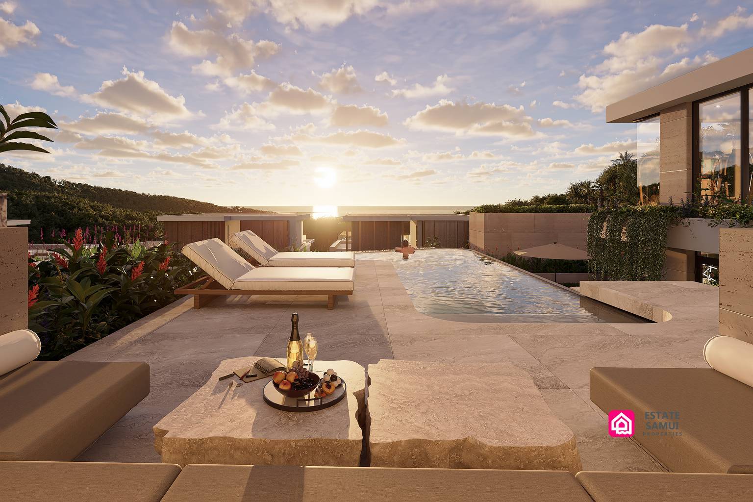 Pool terrace with sun loungers and sunset sea views.