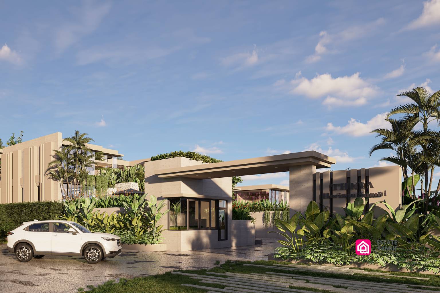 Landscaped entrance with gatehouse, broad canopy and vehicle access.