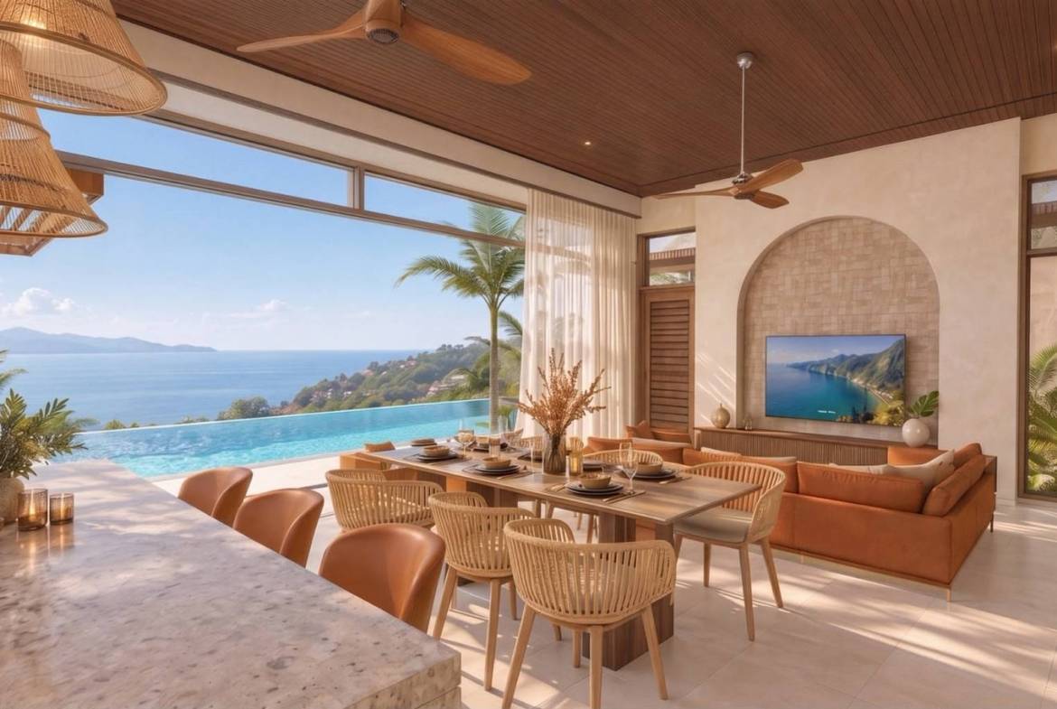 Kitchen island overlooking dining space, lounge and sea views