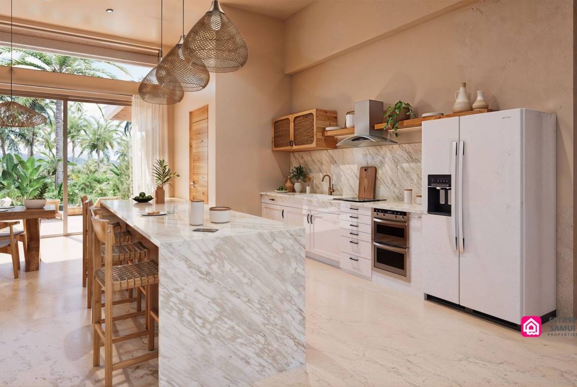 Pale kitchen cabinetry with island, built-in oven and refrigerator