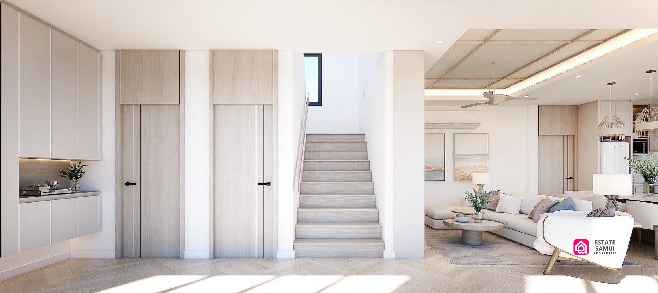 Interior staircase beside built-in cabinetry and open living area