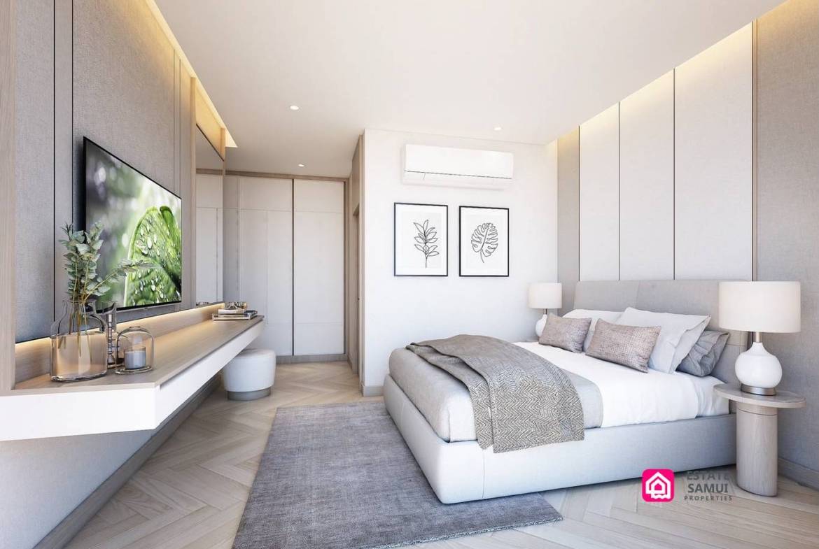Bedroom with padded headboard, floating television console and bedside lighting