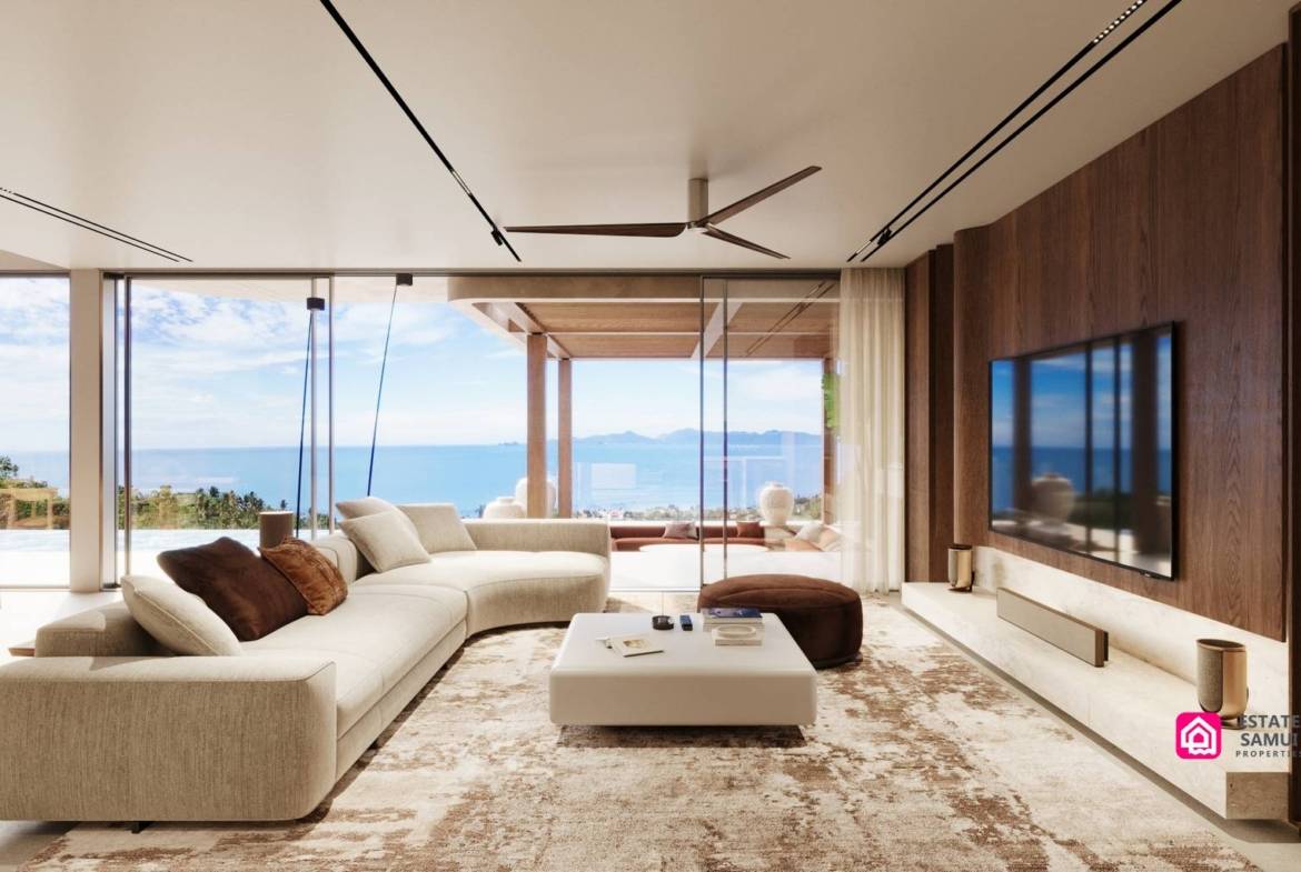 Sea-facing living room with sliding glass doors and timber television wall.