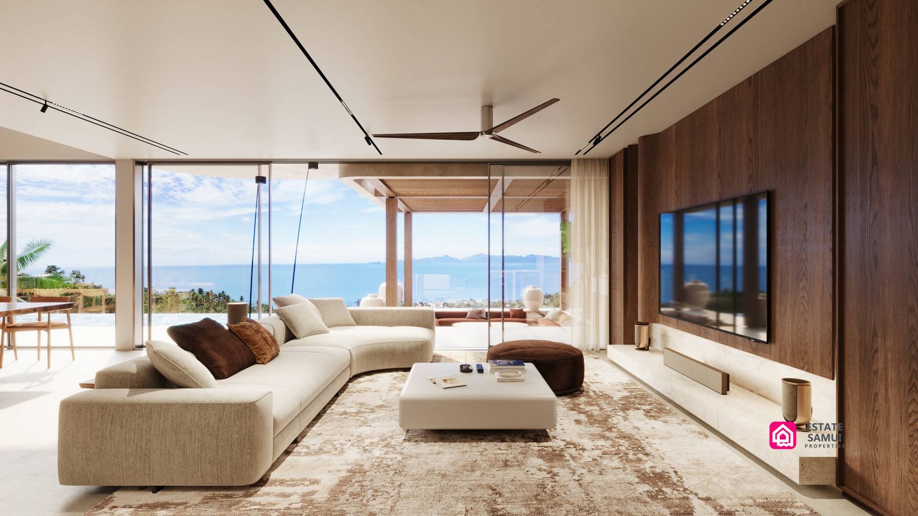 Sea-facing living room with sliding glass doors and timber television wall.